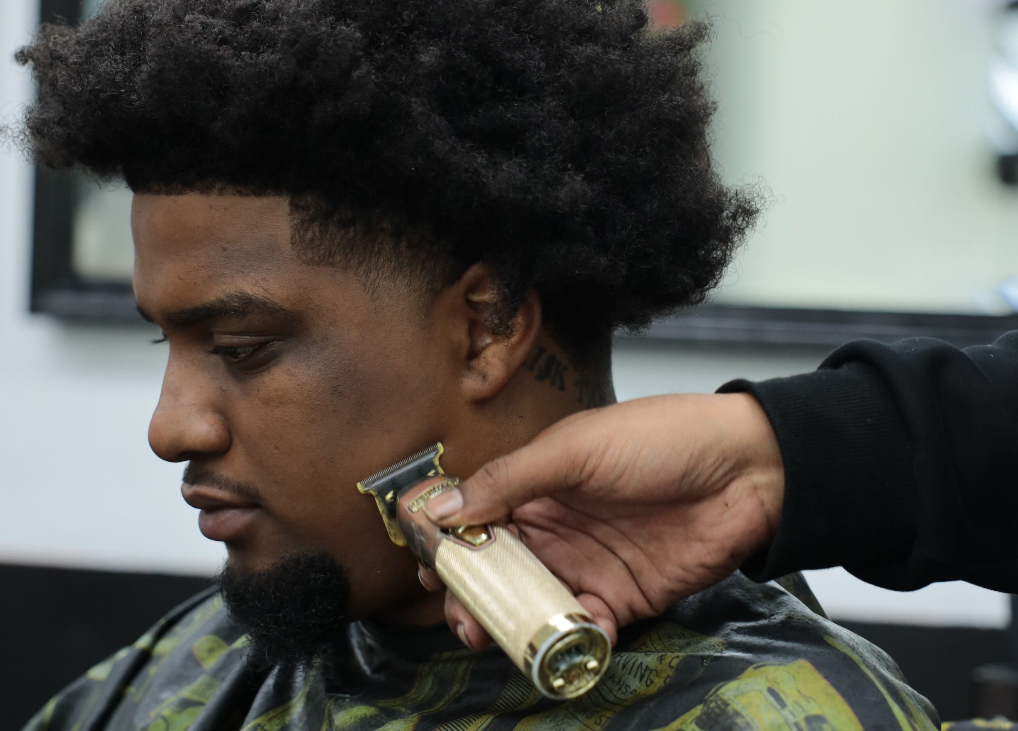 Barber expertly trims hair at Image Unisex Barbershop and Salon, Sicklerville, New Jersey, US.