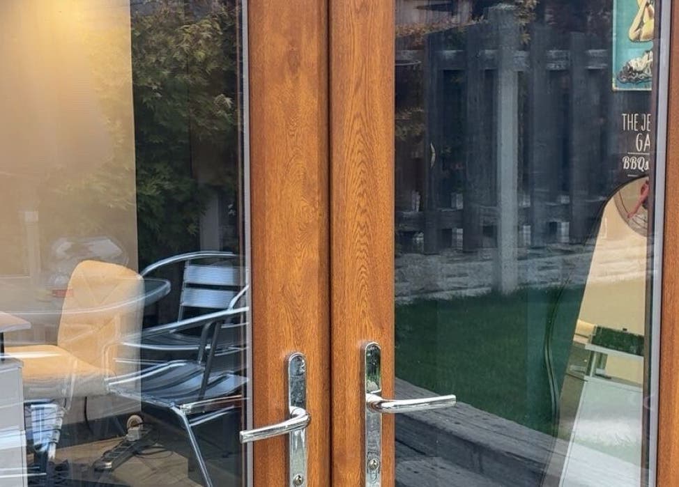 Entrance to Honey’s Haven with wooden doors and garden view in Rotherham, England, GB.