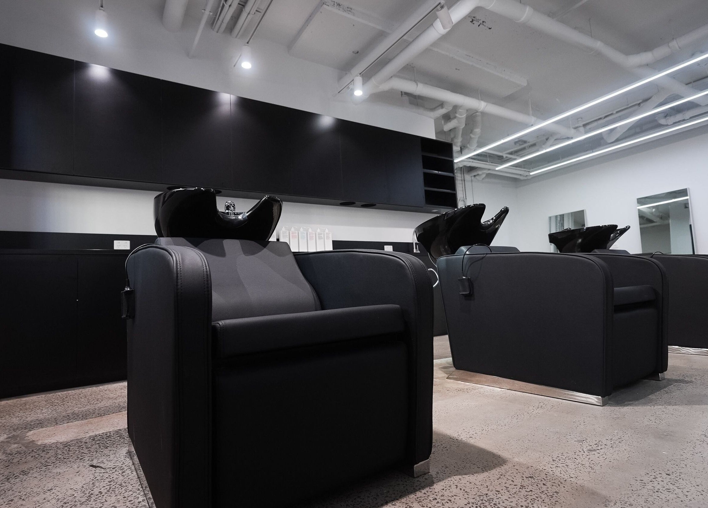 Stylish hair wash stations at ASSORT HAIR PTY LTD in Melbourne, Victoria, AU, offering modern salon services.