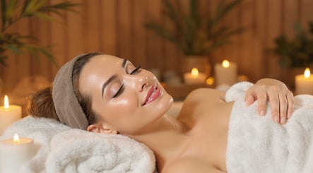 Relaxing spa therapy at Valura Spa, Daerah Istimewa Yogyakarta, ID, surrounded by soft candlelight.
