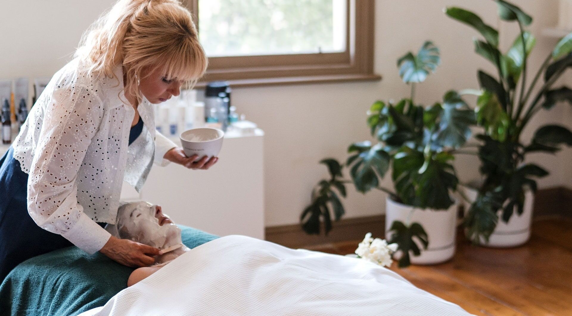 Therapist applying a facial mask at The Peaceful Skin Co, Melbourne, Victoria, AU.