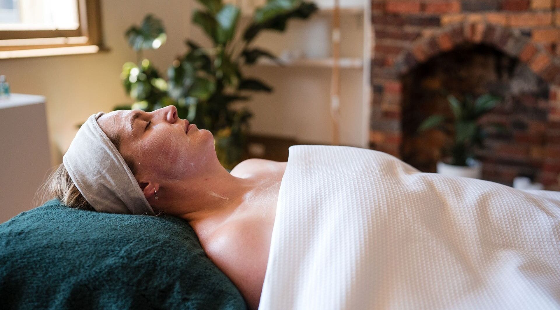 Client receiving a facial treatment at The Peaceful Skin Co, Melbourne, Victoria, AU.