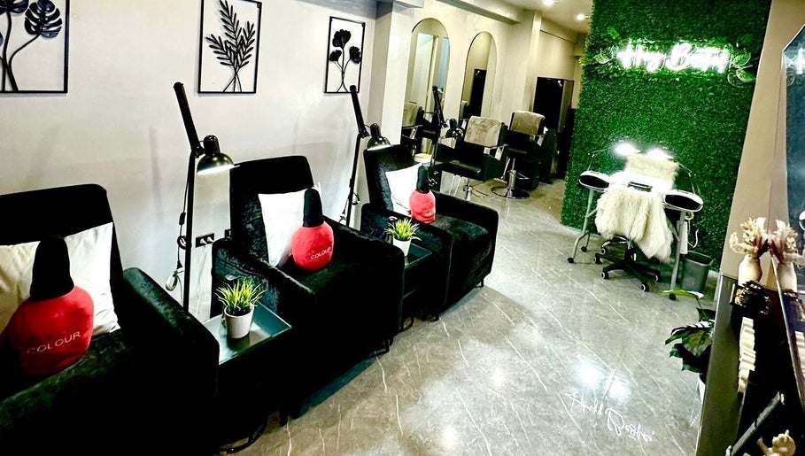 Elegant interior of Marquess Beauty Lounge, Manila, Metro Manila, PH, showcasing modern green and black seating.