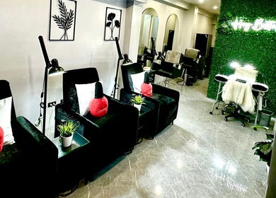 Elegant interior of Marquess Beauty Lounge, Manila, Metro Manila, PH, showcasing modern green and black seating.