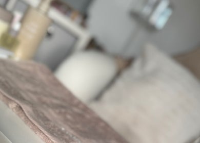 Cozy spa setting at The Gloss Room MCR, Stockport, England, GB with soft towels and elegant decor.