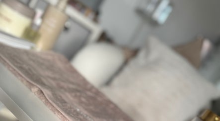 Cozy spa setting at The Gloss Room MCR, Stockport, England, GB with soft towels and elegant decor.