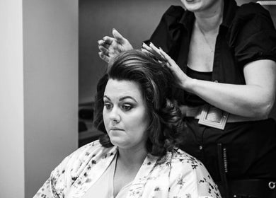 Stylist at KL Creative Hair @ Salon 22, Enniskillen, creating elegant hairstyle for a client.