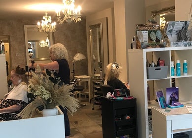 Stylist working at KL Creative Hair @ Salon 22, Enniskillen, Northern Ireland, GB with elegant decor.
