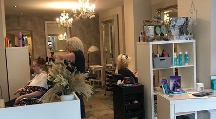 Stylist working at KL Creative Hair @ Salon 22, Enniskillen, Northern Ireland, GB with elegant decor.