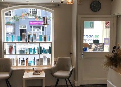 Stylish interior of KL Creative Hair @ Salon 22, Enniskillen, Northern Ireland, GB with elegant product display.
