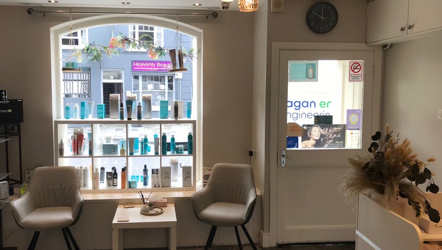 Stylish interior of KL Creative Hair @ Salon 22, Enniskillen, Northern Ireland, GB, featuring modern seating.