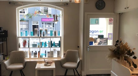 Stylish interior of KL Creative Hair @ Salon 22, Enniskillen, Northern Ireland, GB, featuring modern seating.