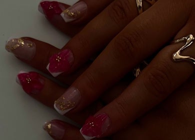 Elegant nail art with floral designs by NailsByKrista in Newmarket, England, GB.