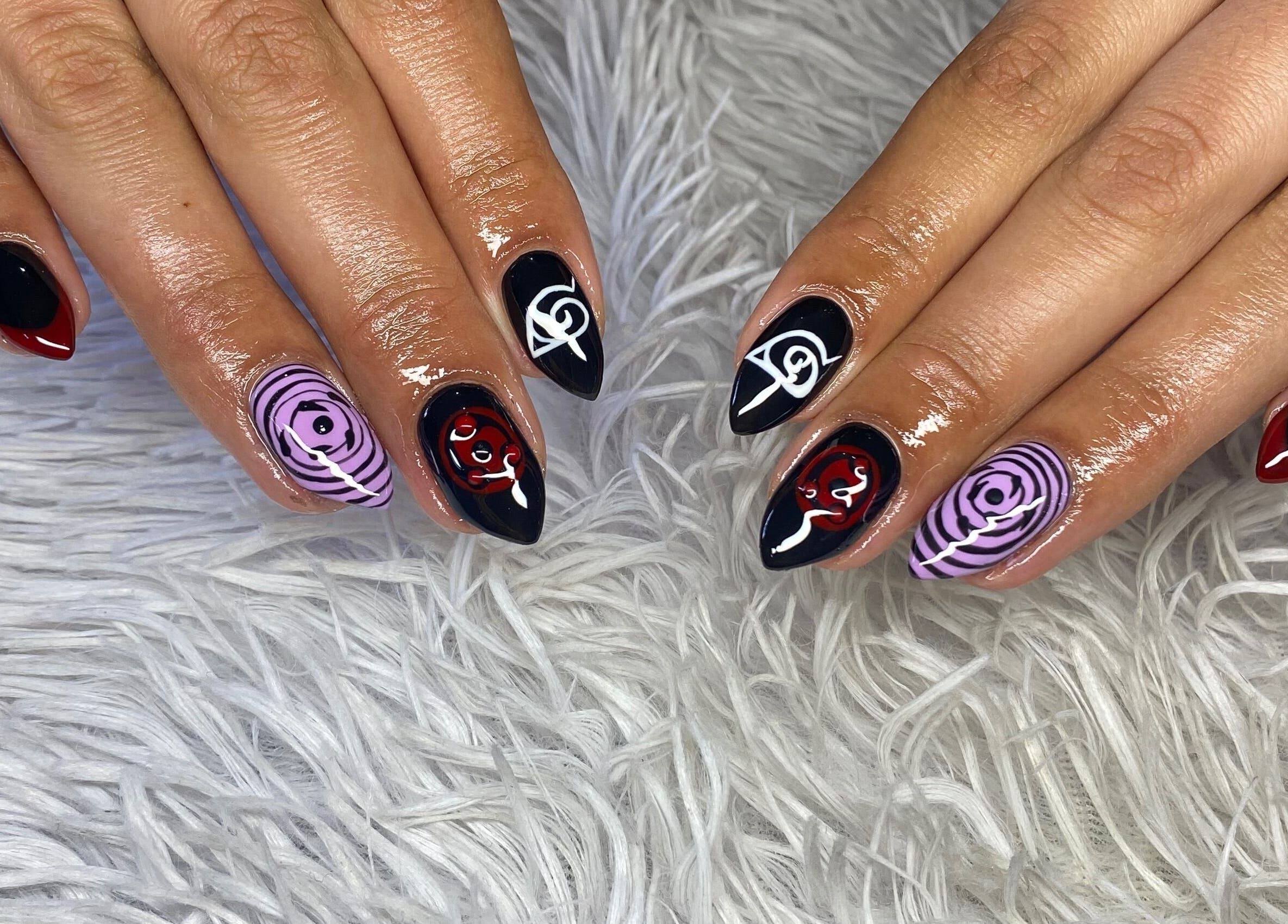 Bold, artistic nail art at your.gelplug in Cape Town, Western Cape, ZA, showcasing black, red, and purple designs.
