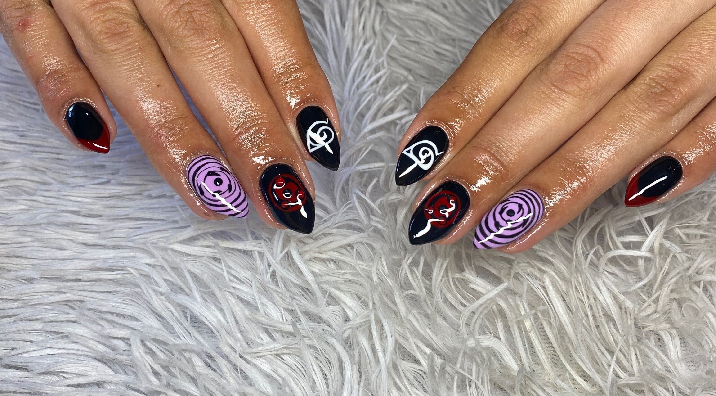 Bold, artistic nail art at your.gelplug in Cape Town, Western Cape, ZA, showcasing black, red, and purple designs.