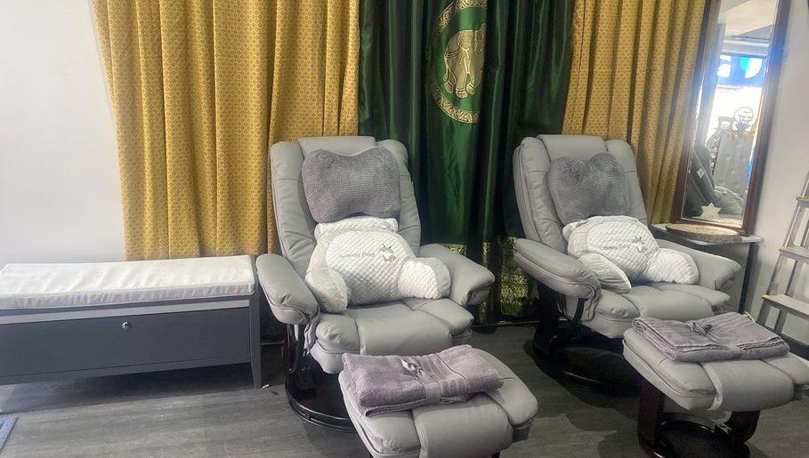 Comfortable armchairs and pillows at BuaKhonKaenThaiTherapies2, Nelson, England, GB.