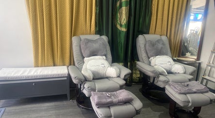 Comfortable armchairs and pillows at BuaKhonKaenThaiTherapies2, Nelson, England, GB.