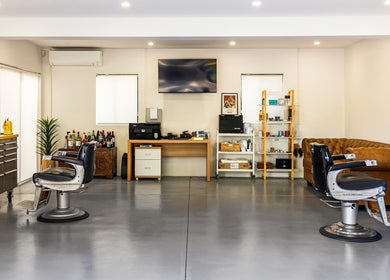 Modern barber chairs in Dapper Man London, West Wollongong, New South Wales, AU, chic interior design.