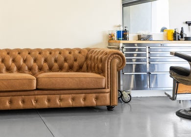 Elegant barber chair and vintage sofa at Dapper Man London, West Wollongong, New South Wales, AU.