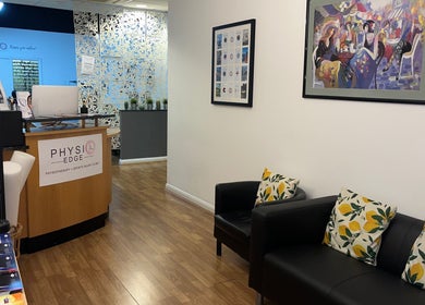 Reception area of Physio Edge Films, London, England, GB. Stylish decor with comfortable seating.