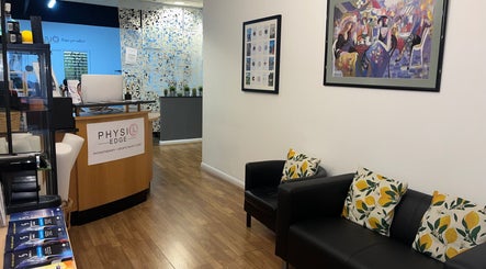 Reception area of Physio Edge Films, London, England, GB. Stylish decor with comfortable seating.