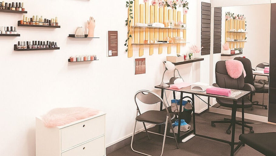 Chic interior of Happy Nails in Braga, Braga, PT, showcasing manicure tables and polish displays.