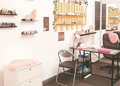 Chic interior of Happy Nails in Braga, Braga, PT, showcasing manicure tables and polish displays.