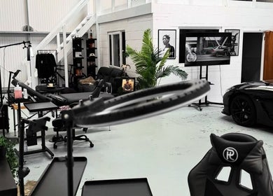 Modern interior of Jay Soze Fineline Tattoo Artist studio in Peterborough, England, GB with sleek black decor.