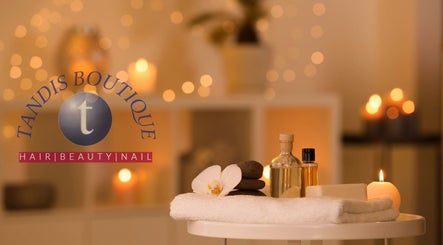 Relaxing spa setup with candles and oils at Tandis Boutique, Birmingham, England, GB.