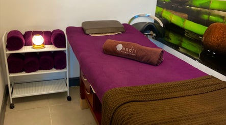 Relaxing massage bed setup at Tandis Boutique in Birmingham, England, GB with plush towels and calm ambiance.