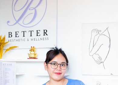 Staff member at Better Aesthetic and Wellness, San Mateo, Calabarzon, PH, warmly greets in a stylish interior.