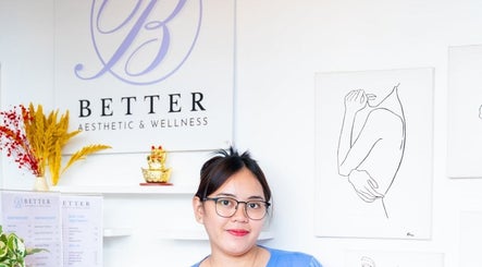 Staff member at Better Aesthetic and Wellness, San Mateo, Calabarzon, PH, warmly greets in a stylish interior.
