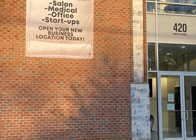 Thatgirl_Tiny venue entrance with brick facade in Staten Island, New York, US, offering space for salons and offices.
