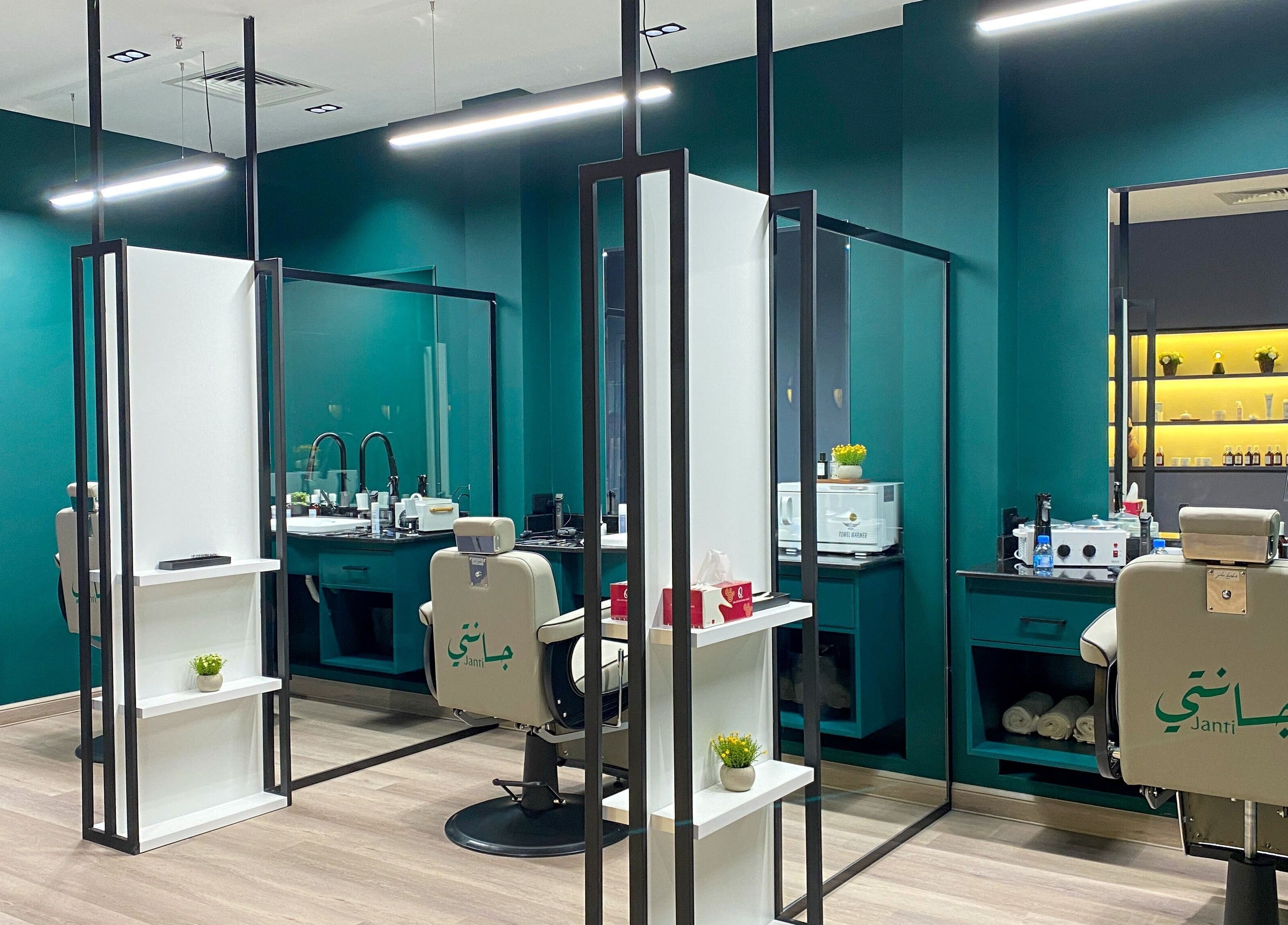 Modern interior of Janti Salon for Men in Doha, Doha Municipality, featuring stylish barber chairs and decor.