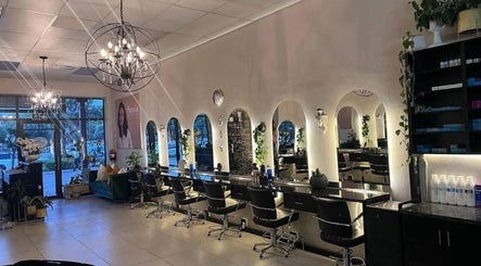Elegant salon interior at Tella The Hybrid Stylist, Pretoria, Gauteng, ZA with stylish mirrors and chic lighting.