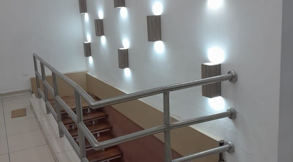 Modern stairway with stylish wall lights in Beauty Salon, San Pedro Sula, Cortés Department, HN.