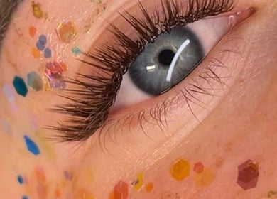 Close-up of a glittered eye makeup at GlowHeadSpa, San Pawl Il-baħar, MT, showcasing intricate lash detail.