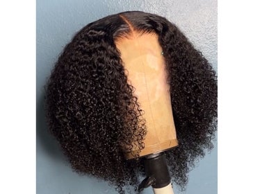 Curly wig styled by Crownedbycassie in Lauderhill, Florida, US. Enhancing natural beauty.