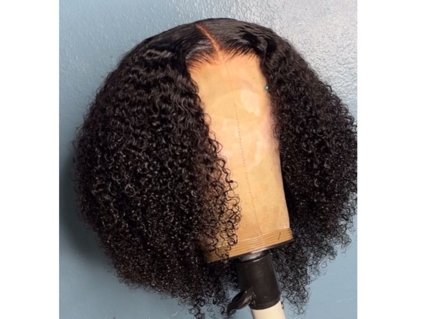 Curly wig styled by Crownedbycassie in Lauderhill, Florida, US. Enhancing natural beauty.