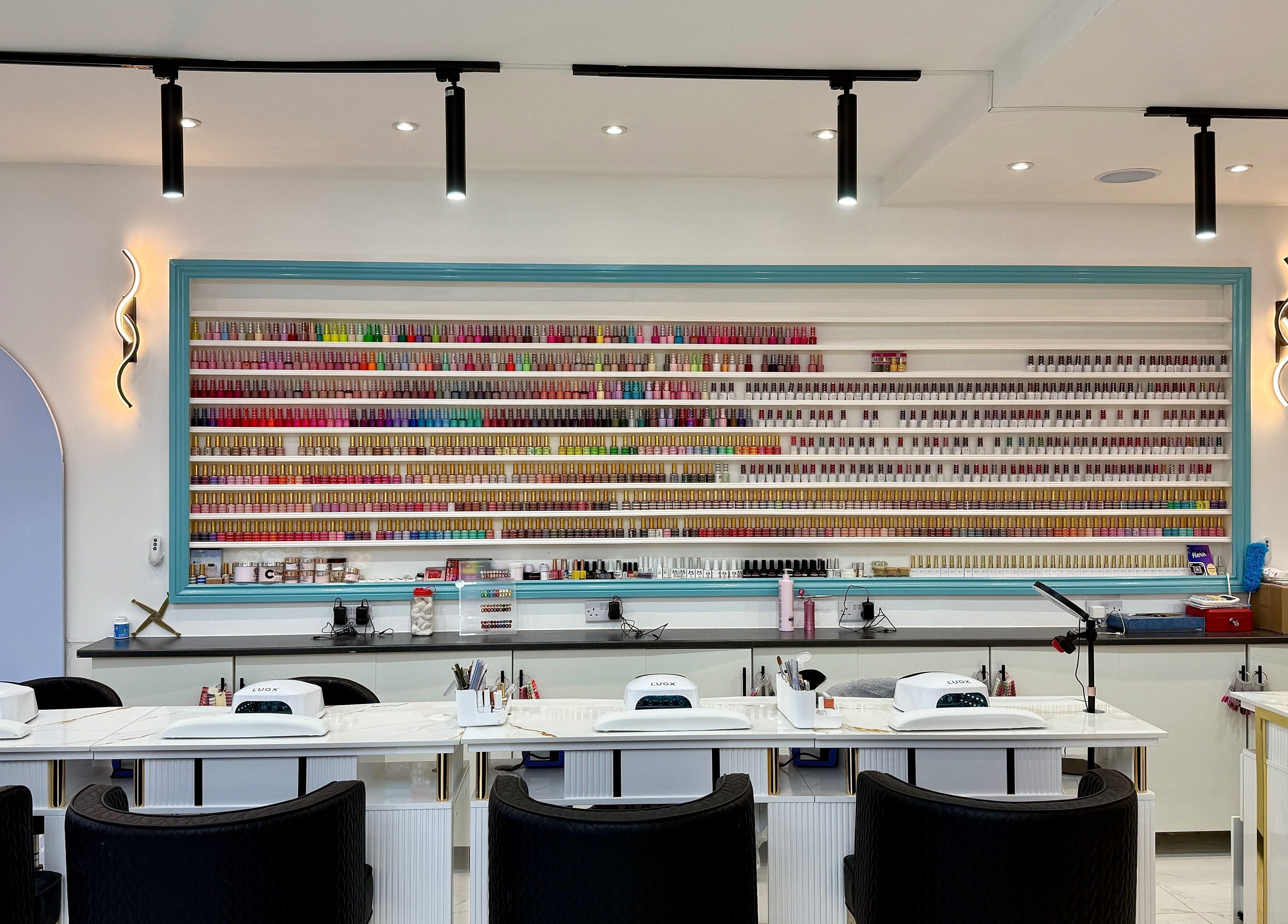 Brigid Nails salon in Monaghan, County Monaghan, IE with colorful nail polish display and manicure stations.