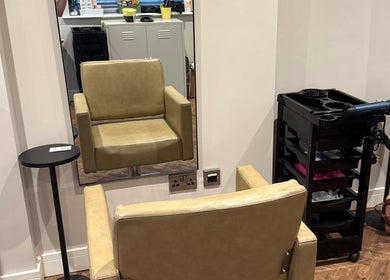 Comfortable salon chair at Natasha Ellen Hair, Sarisbury Green, England, GB with styling tools nearby.