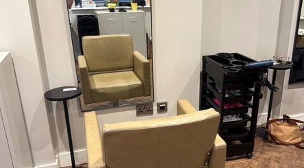 Comfortable salon chair at Natasha Ellen Hair, Sarisbury Green, England, GB with styling tools nearby.