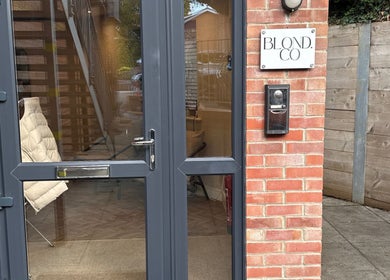 Entrance of Natasha Ellen Hair salon, glass doors with sign, Sarisbury Green, England, GB location.