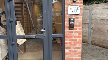 Entrance of Natasha Ellen Hair salon, glass doors with sign, Sarisbury Green, England, GB location.