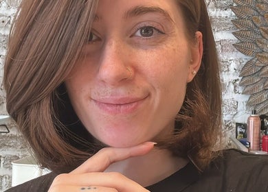 Smiling woman with chic haircut at La Rossa Hairstyles, Dublin, County Dublin, IE.