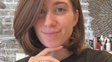 Smiling woman with chic haircut at La Rossa Hairstyles, Dublin, County Dublin, IE.