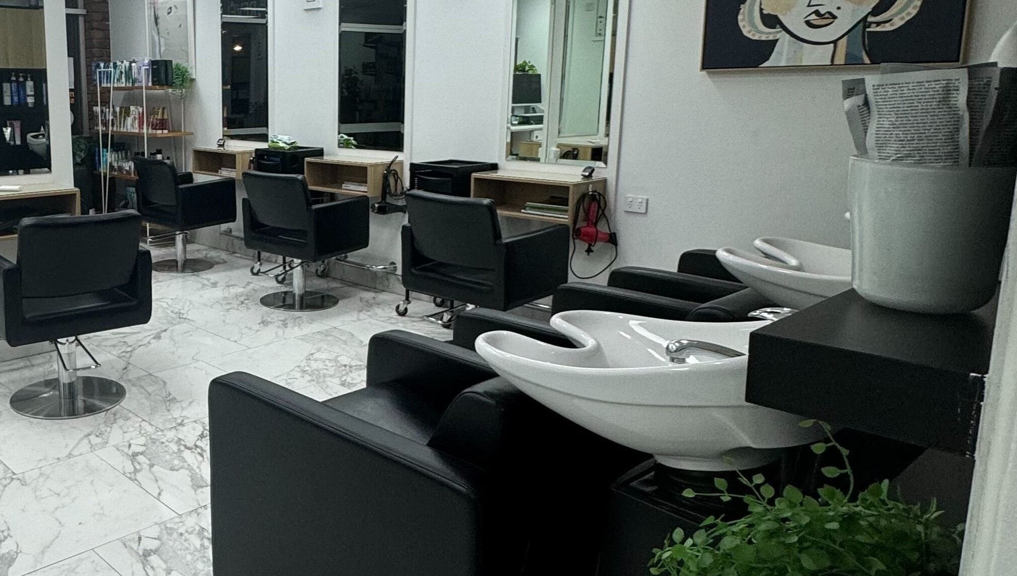 Modern interior of Revelations In Hair Design, Wellington Point, Queensland, AU, featuring chic styling chairs.