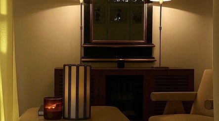 Elegant room at Noble Men’s Spa, New York, New York, US with warm lighting and serene decor.