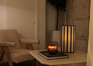 Cozy lounge at Noble Men's Spa, New York, featuring a plush chair and ambient lighting.
