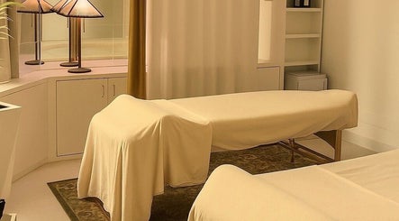 Relaxing massage room at Noble Men’s Spa, New York, New York, US with warm lighting and cozy ambiance.